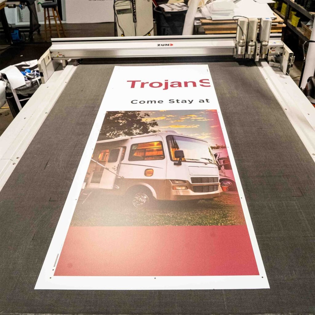 Printed pop-up banner on CAD cutting table.