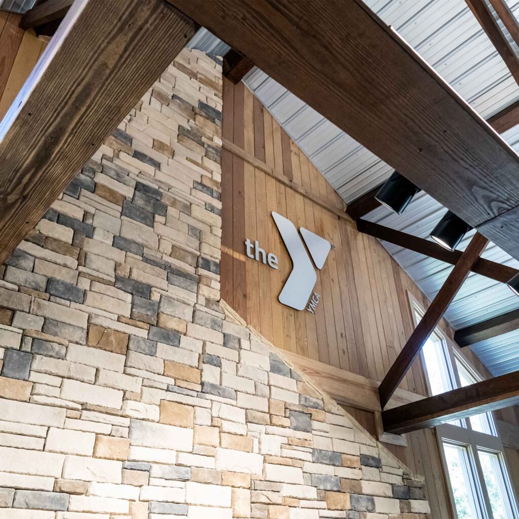 An indoor silver sign inside a cabin.